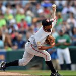 baseball player throwing a pitch